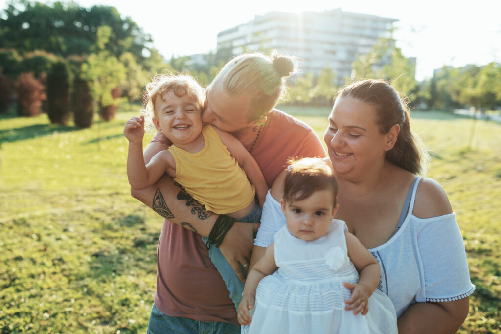 Young parents with their two kids in the park